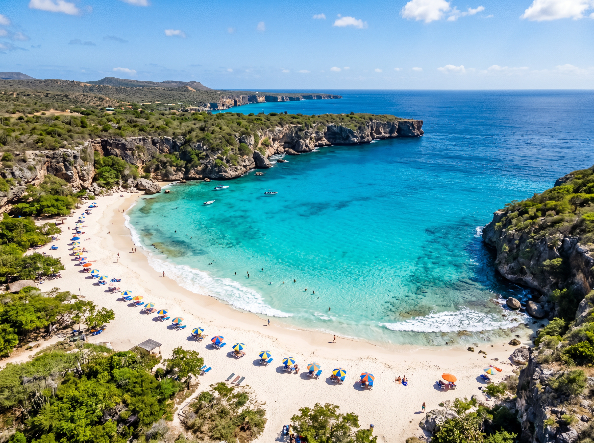 Aerial view of a turquoise Curaçao bay with white sand beach